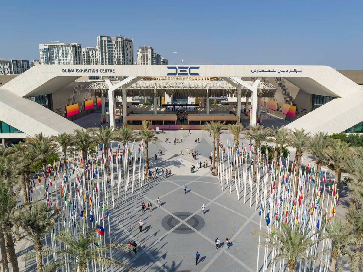Aerial view of the Dubai Exhibition Centre entrance and flag-lined plaza